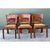 This set of six vintage Bauer dining chairs showcases refined craftsmanship through its distinctive carved backrest, each...