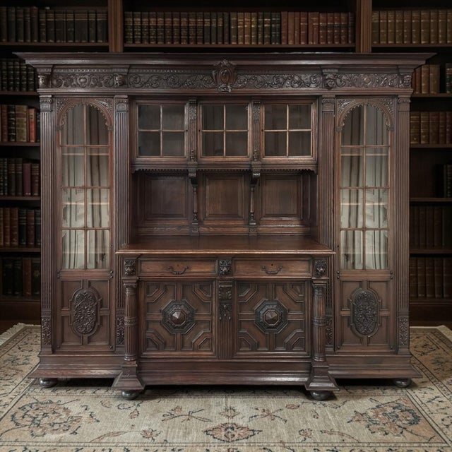This extraordinary 19th century French Renaissance Revival carved oak bookcase bar is monumental in scale and richly...