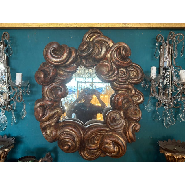 19th Century Italian Baroque Cloud Mirror. Offered is a stunning late 18th to early 19th century Italian Baroque giltwood...