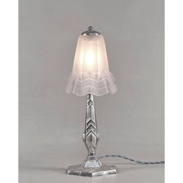 Degué A French 1930s art deco lamp. A nicely shaped art deco base in nickel plated solid brass or bronze holds a shade by...