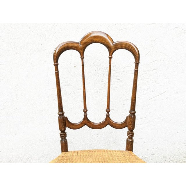 Elegant and decorative Chiavarina chair in wood and original Vienna straw seat. Partially restored: one leg was repaired....