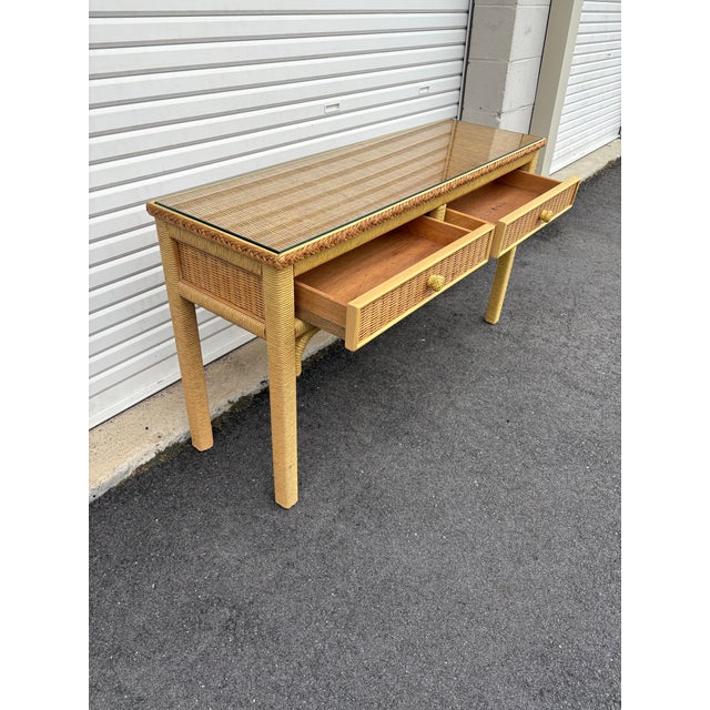 Vintage Coastal rattan wrapped legs and wicker insert drawers with removable glass top. 2 drawers with Henry Link mark...