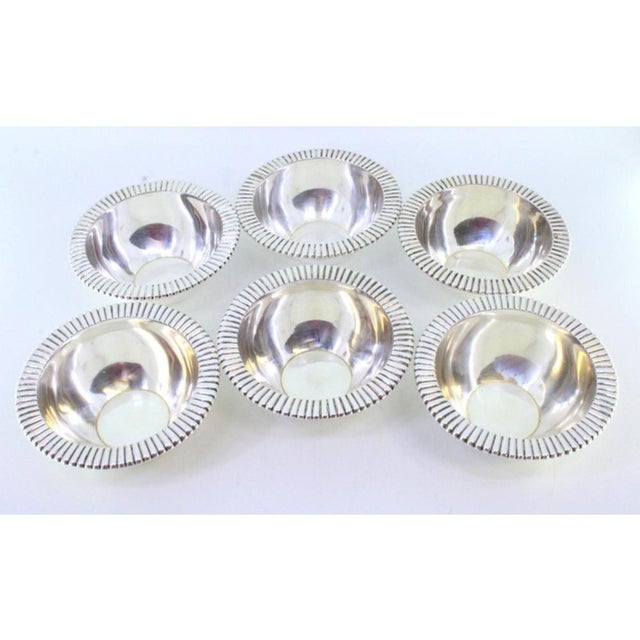 Silver Washbasins with Raised Edges, Set of 6, in Very Good conditions. Designed 1920 to 1949 This piece has an...