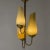 Captivating chandelier by Gunnel Nyman and Paavo Tynell, made from brass with light yellow glass shades. Impressive size....