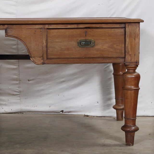 Antique Anglo-Indian Teakwood Partner's Writing Table, in a glorious fruitwood color and patina, with a shaped kneehole,...