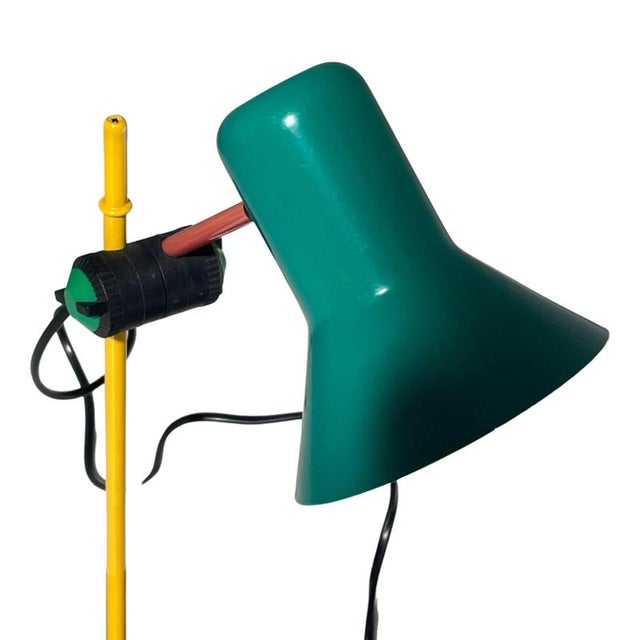 Bright colored floor lamp by Veneta Lumi. Made in the 1980’s and a schoolbook example of design. Will look amazing between...
