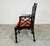 A set of 6 solid mahogany dining open armchairs featuring pagoda-crest backs, intricate openwork lattice splats, fretwork...