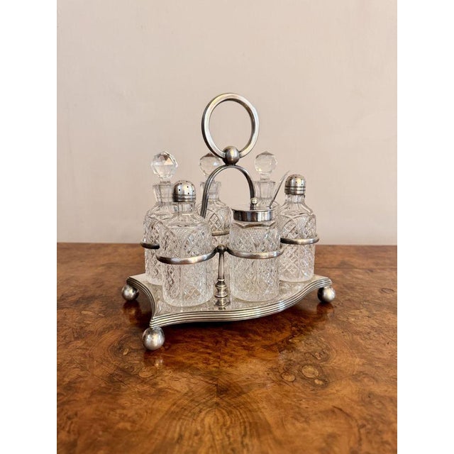Lovely quality antique Edwardian silver plated six bottle cruet set, having a quality silver plated stand with a circular...