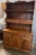 This Colonial style cherry wood hutch and buffet was crafted in the United States during the mid-20th century, likely...
