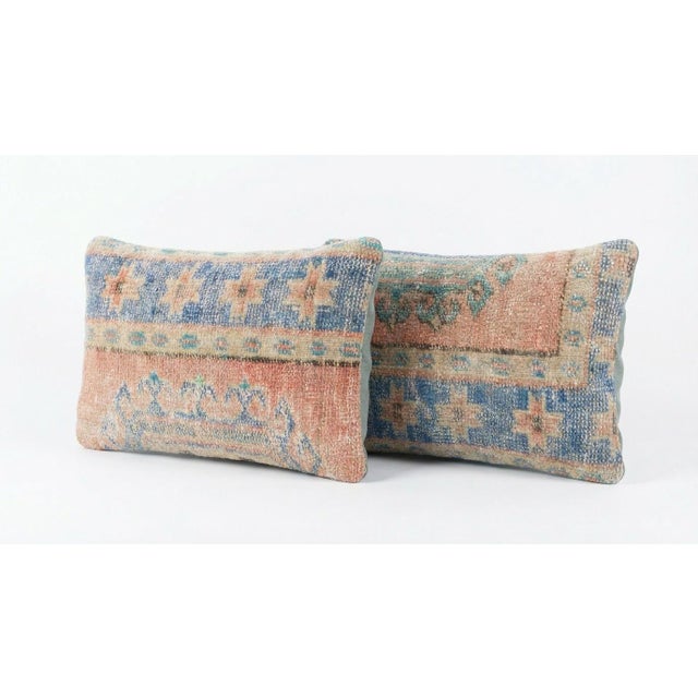 This beautiful 16'' x 24'' pillow cover set was made from authentic Turkish rug pieces. Bright colors of wool adorn the...