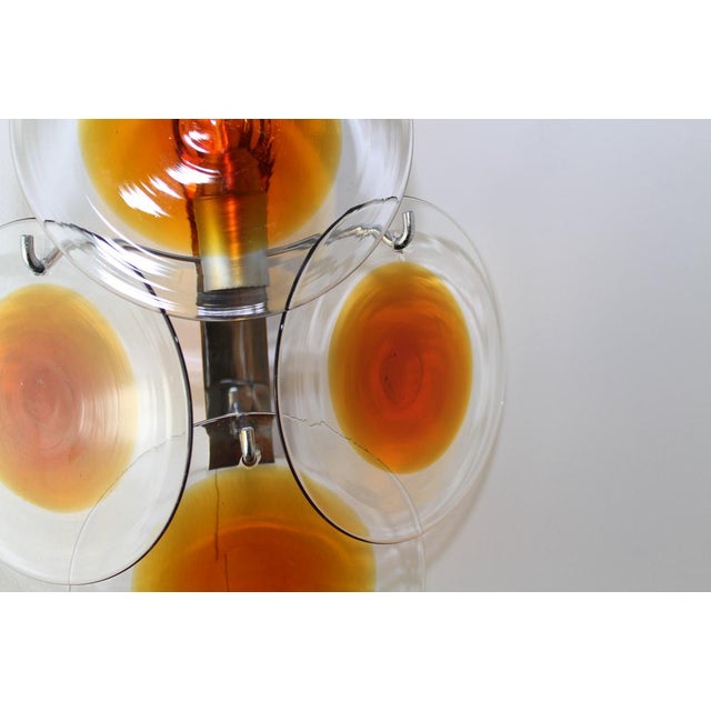 4 hand-blown glass panes with amber-colored meltings, chrome frame, 5 E14 sockets, diameter of the glass panes approx. 14...