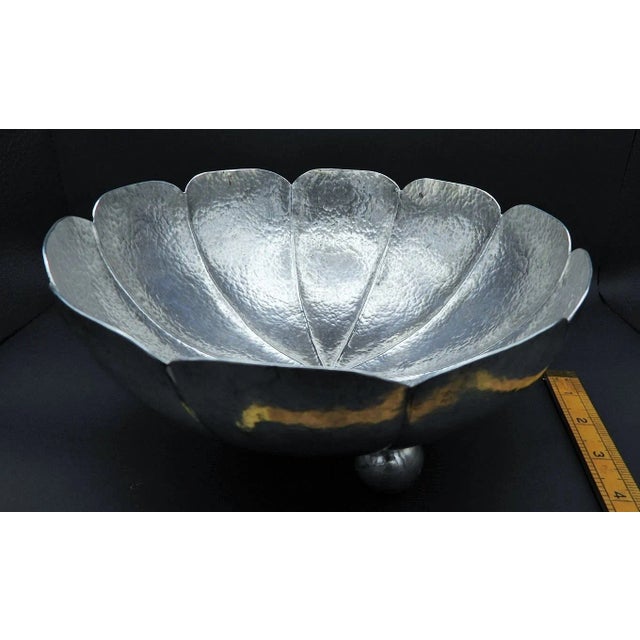This marvelous serving bowl is created in gorgeous silver [most likely silver plate] in the shape of a lotus blossom with...