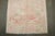 a mid 20th century floral turkish anatolian rug in pinks, creams soft greens