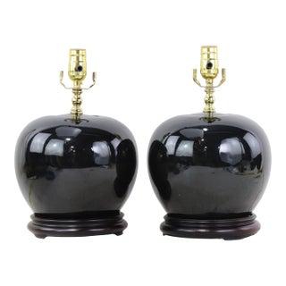 A Pair Early 20th Century Black Monochrome Porcelain Watermelon Jar Table Lamps on Carved Wood Bases For Sale