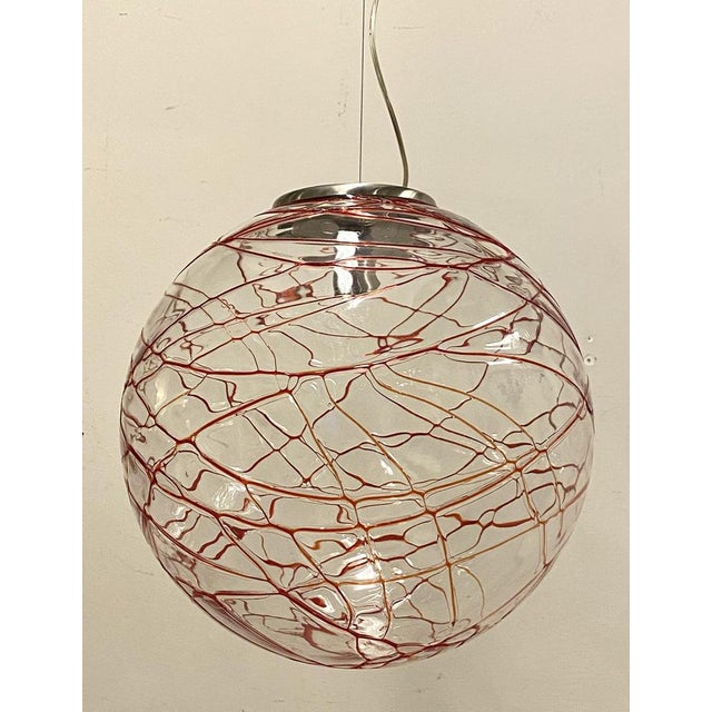 80s chandelier consisting of a large murano glass bowl with red/orange decorations, steel structure, adjustable height....