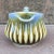 Vintage ceramic creamer, made by Wade of Ireland. Unusual color schemes of blues, greens and browns. Striking appearance...
