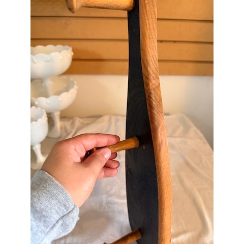 Hanging shelf in the shape of an oar. Does have holes where screws are to be used. 4 pegs. Some minor wear and tear as...
