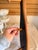 Hanging shelf in the shape of an oar. Does have holes where screws are to be used. 4 pegs. Some minor wear and tear as...