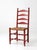 Vintage ladder back chair with a beautifully timeworn deep red painted finish and woven rush seat. Four shaped back slats...