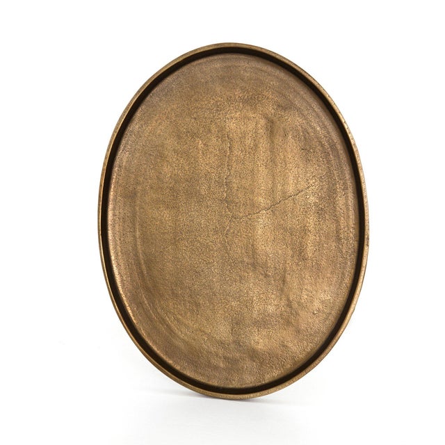 The tripod table with a cleverly balanced twist. Angular cast aluminum is finished in raw brass to accentuate highs and...