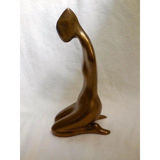 Girl Seated a la Japonaise, 1964, polished bronze. It was exhibited at The Chapman Gallery NYC in 1968. Cast at Morris...