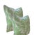 Bring the breezy beauty of the tropics into your home with this bold botanical throw pillow. Featuring a vibrant green...