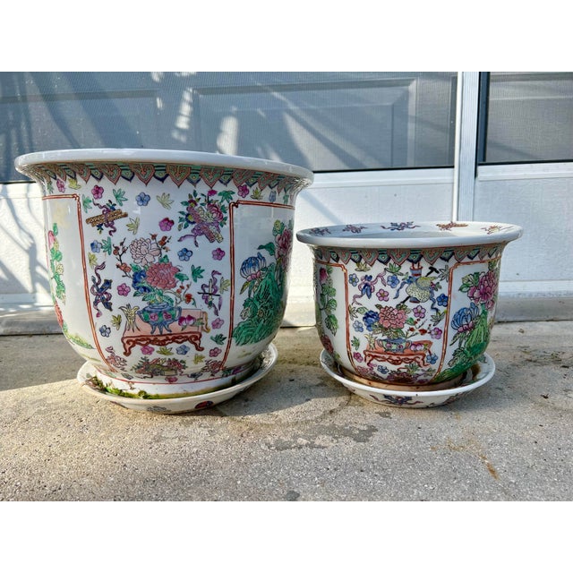 Elevate your space with this stunning pair of vintage Chinese Famille Rose porcelain planters. Beautifully hand-painted...