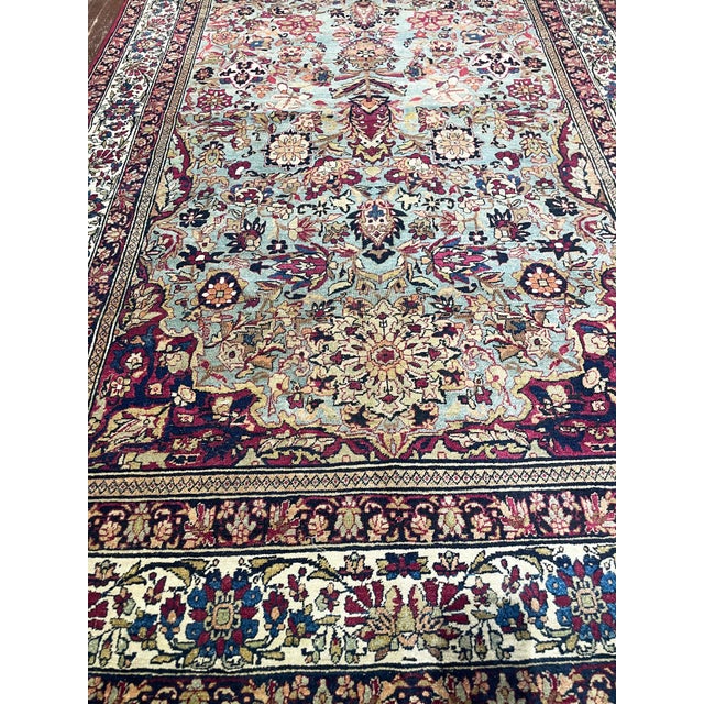 Material: Fine Kork wool pile on cotton foundation. This exceptional antique Persian Isfahan rug is a beautifully woven...