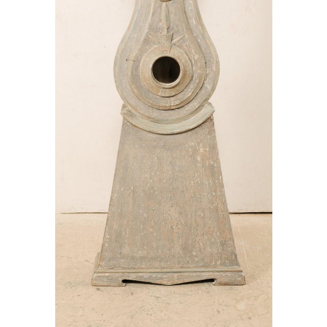 An early 19th century Northern Swedish painted wood grandfather clock with nice trimmings. This antique floor clock from...