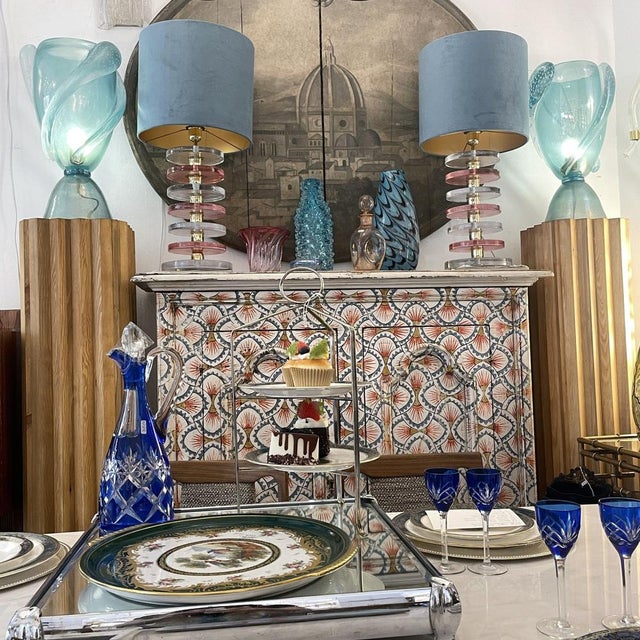 A pair of handcrafted illuminated columns, made of pine wood in the Art Deco style. with a two-tiered stepped base, the...