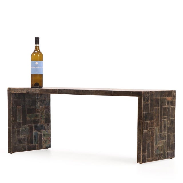 The rectangular top of this coffee table is finely inlaid with a shimmering marquetry surface of natural mica, displaying...