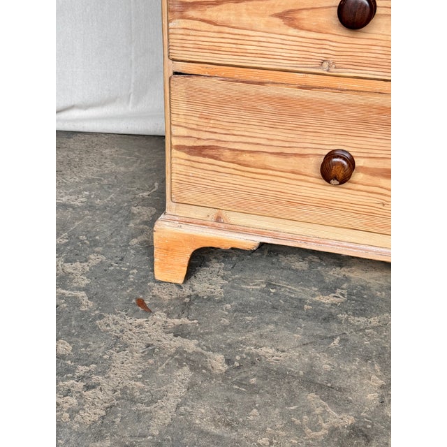 This is a lovely English 2 over 3 pine chest! This piece dates to the 19th century and has lovely patina. The wood has a...