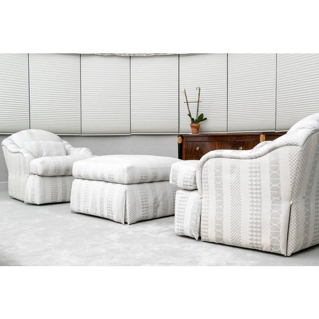 A luxurious pair of club chairs with an ottoman, designed by Sally Sirkin Lewis for J. Robert Scott, features oversized...