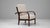 20th century French Art Deco upholstered armchair featuring a reclining backrest and the elegant curvature typical of the...