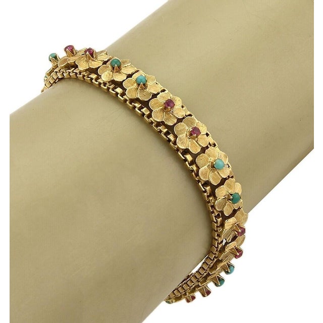 This authentic vintage floral link bracelet is a beautifully crafted piece that reflects timeless elegance and intricate...