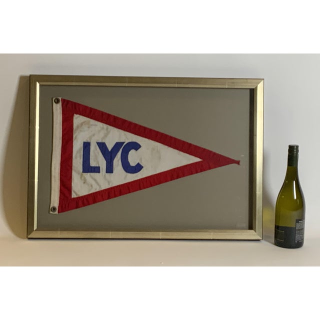 Linen nautical flag from the Lauderdale Yacht Club. With brass grommets. Shows use on the ocean. Custom frame with gray...