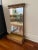A fine vintage beveled mirror encased in gilt wood. This is two pieces with the bottom piece being a wood box with a slide...