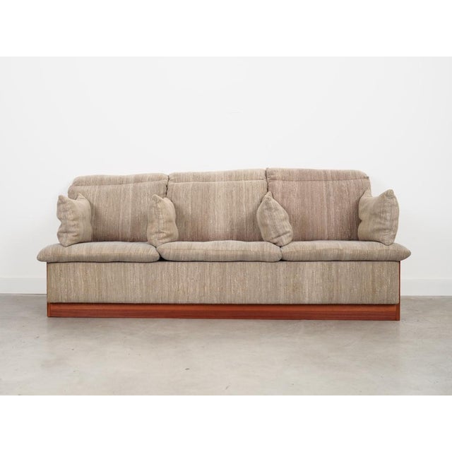 The sofa was made in the 1970s, Danish production. The structure of the furniture is made of teak wood. Wood after...