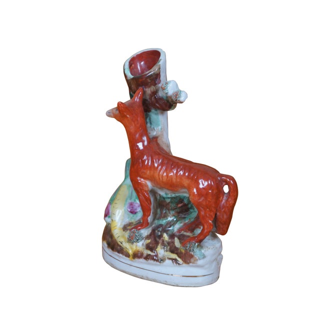 Antique Staffordshire porcelain figural pastille burner / spill vase depicting a lean red fox standing by a tree stump...