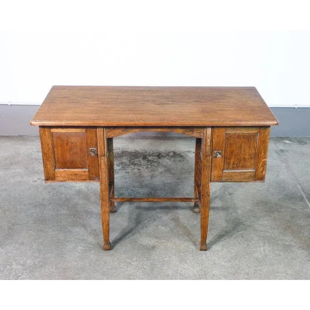 Art deco desk in oak wood, with two compartments origin italy period early 20th century materials oak wood dimensions...