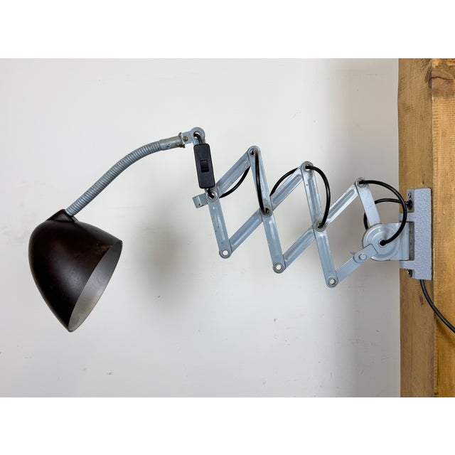 This vintage adjustable gooseneck industrial scissor wall light was produced by Elektroinstala in former Czechoslovakia...
