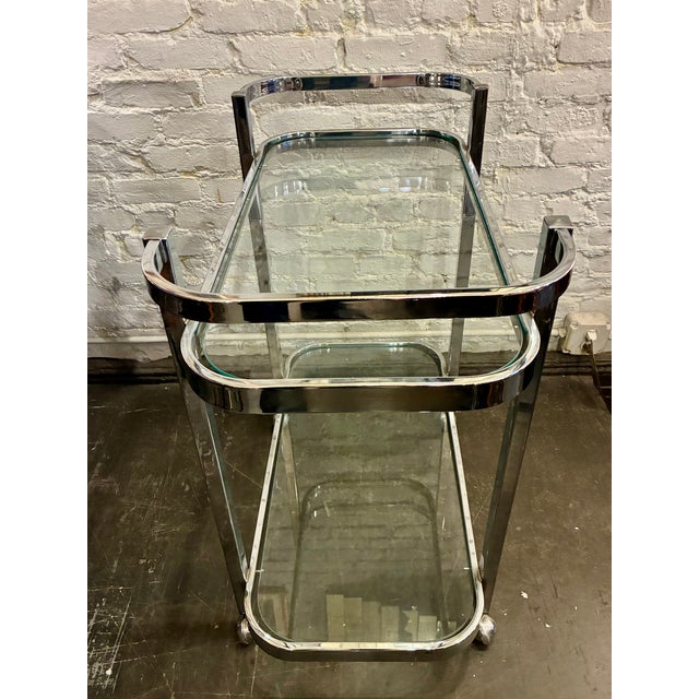 Chrome & Glass two tier Serving Trolley from the 1970s in excellent condition, it measures 17 x 30 1/4 x 31″h.