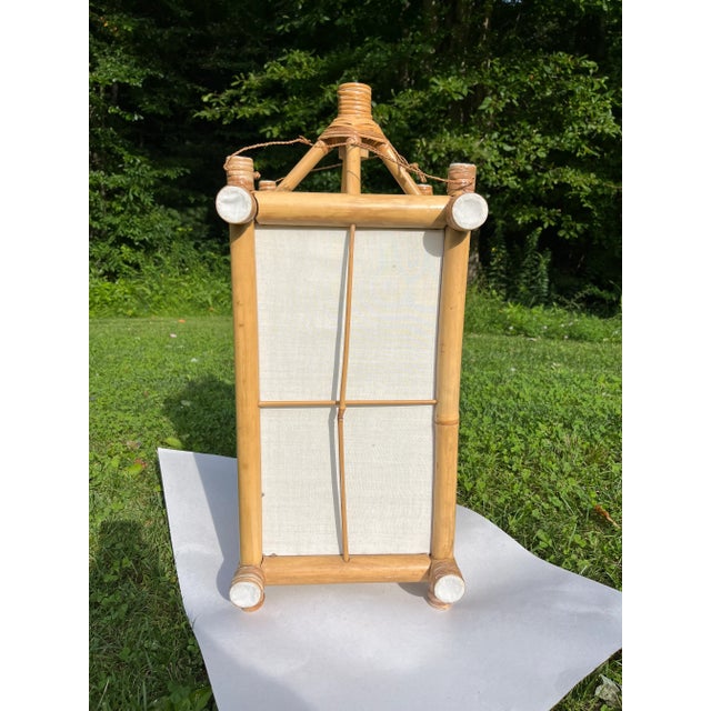 Single rectangular bamboo framed lantern with fabric sides.