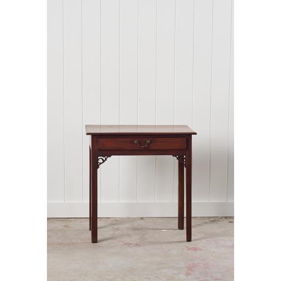 This Georgian side table (c.1800) features one drawer for additional storage, fitted with the original brass pull. It is...