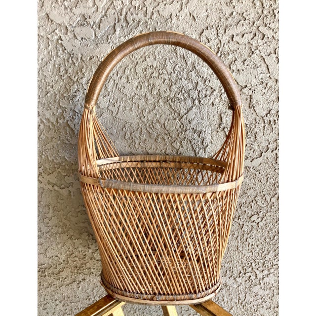 Excellent Pre-Owned Condition. This cutie has been delicately handwoven from rattan reed, the inner core of the rattan...