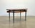 1960s coffee table, black lacquered metal frame and brass tips, teak wood top and details