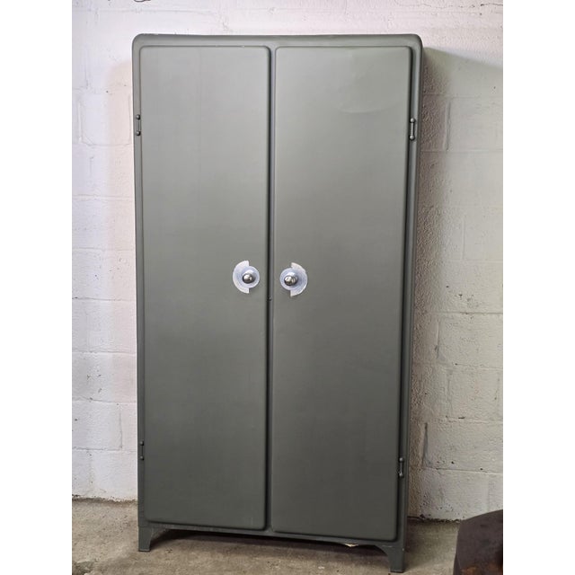 Metal kitchen cabinet. 1950. It was used to store drinks, canned goods, and even other foodstuffs. The exterior has been...