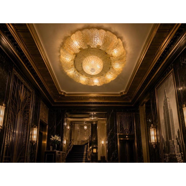 Large Murano Flush Mount with Double Row of Dew-Textured Glass Leaves and Gold Leaf Decoration This magnificent Murano...