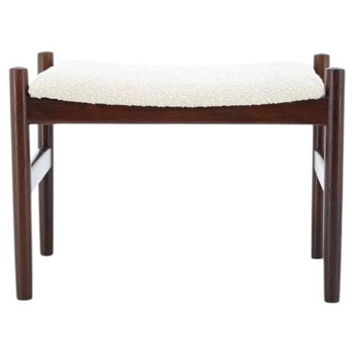 A charming mid-century modern stool or small ottoman, manufactured in Denmark during the 1960s. This piece exemplifies the...