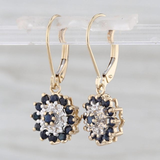 Gemstone Information: - Natural Sapphires - Total Carats - 0.96ctw Cut - Round Color - Dark Blue Treatment - Heated -...